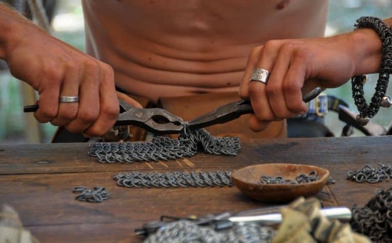 Viking making chainmail